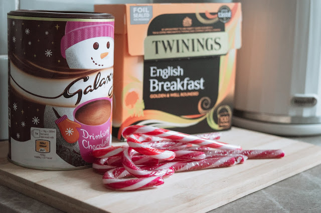 Christmas hot drinks station with hot chocolate, candy canes and English breakfast tea