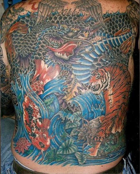 Dragon, koi, and tiger tattoo on a male's full back.