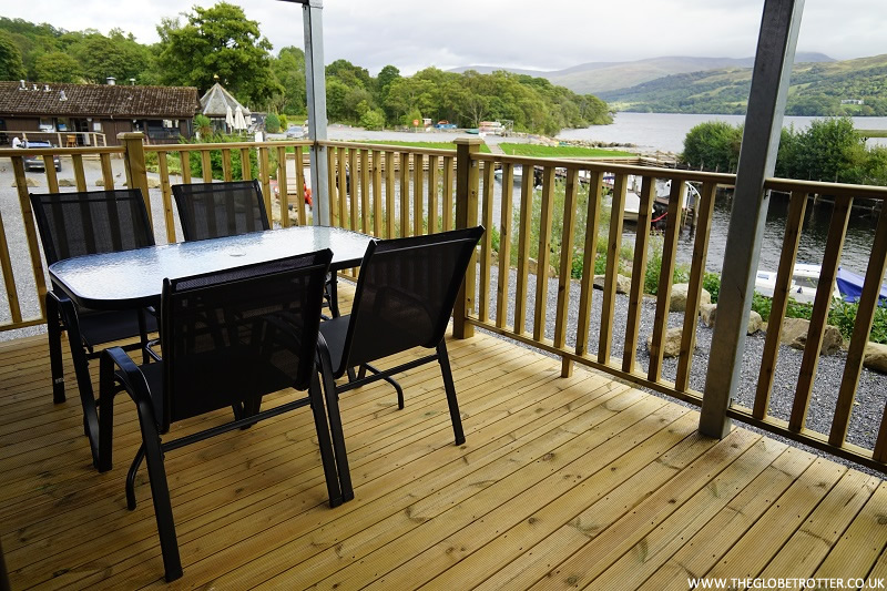 Outdoor seating in the Waterfront Lodge at Loch Tay Highland Lodges