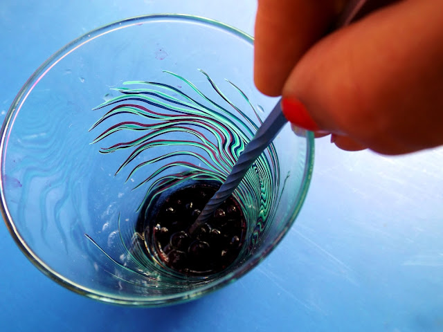 Muddling berries to create a shrub syrup