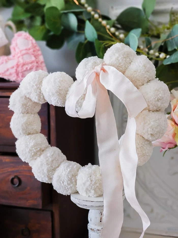 pom pom wreath, pink ribbon