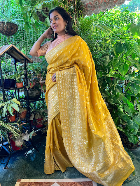 Gold Tussar saree with unicorn motifs in the border.