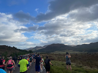 Runners taking pictures of mountains.