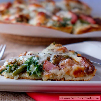 A recipe for deep dish pizza with ham, green beans and sweet potatoes sandwiched between a mashed potato-spread pizza crust and a layer of provolone cheese. Turn those leftovers into a Friday Night Pizza!