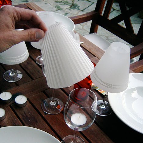 These parchment lampshades easily slip over your wine glasses to transform