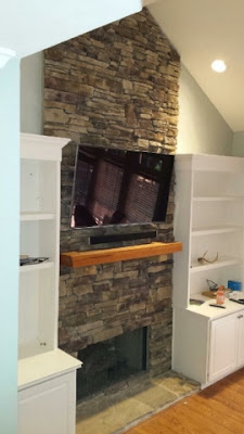 Flat screen HD tv mounting service in Charlotte NC, 4K ultra HD tv mounted on stone fireplace in Charlotte NC, Carolina Custom Mounts, professional tv mounting company in Charlotte NC