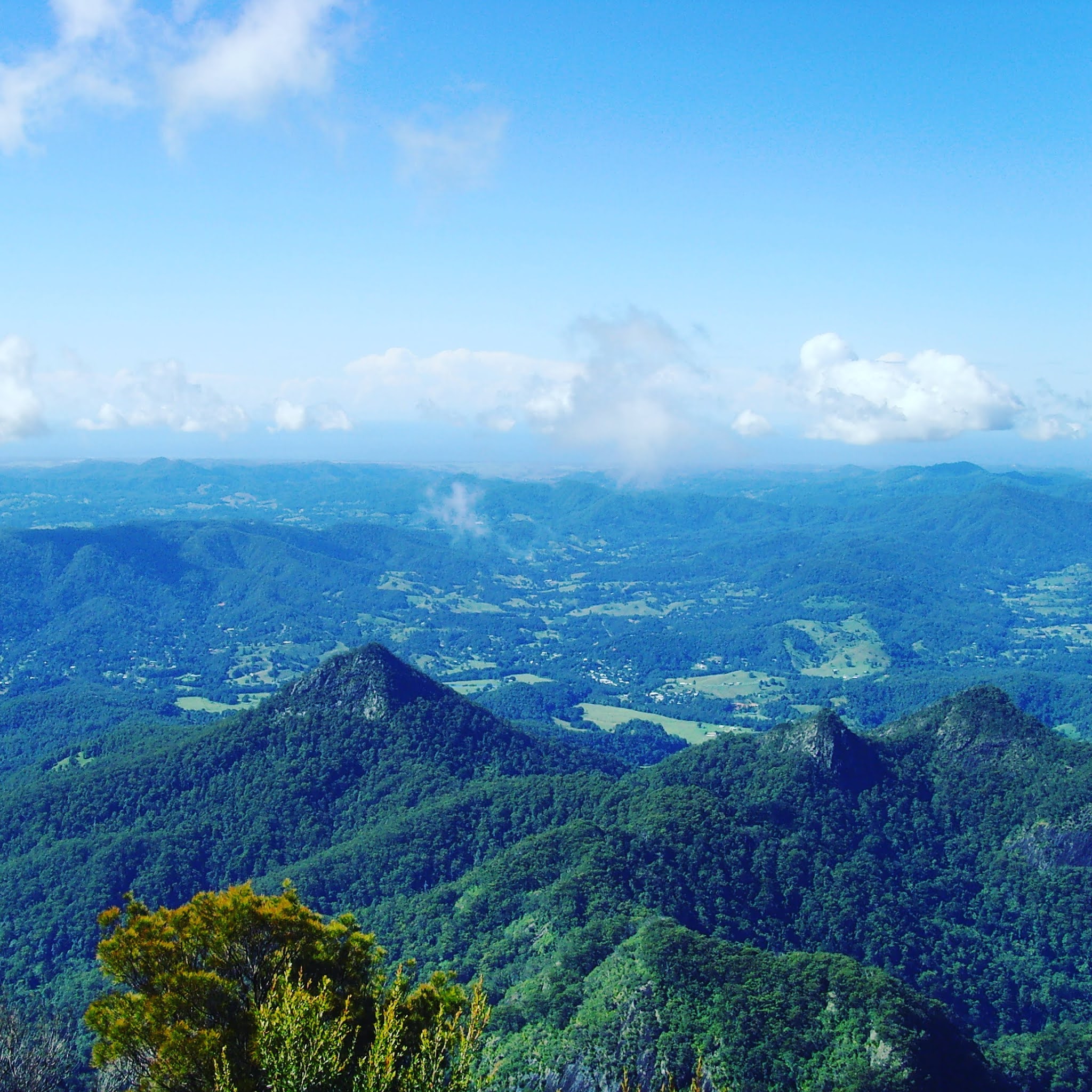 green hills and sky from wollumbin australia on the drive from Sydney to cairns