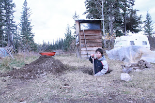 Outhouse hole being dug