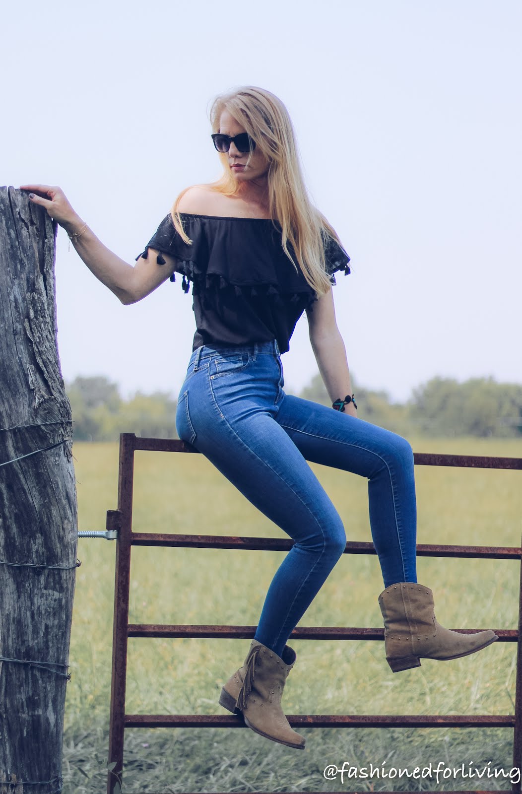 off the should tassel top with skinny jeans and fringe cowgirl boots