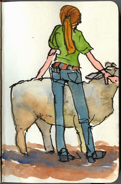 Petite young woman with her sheep.