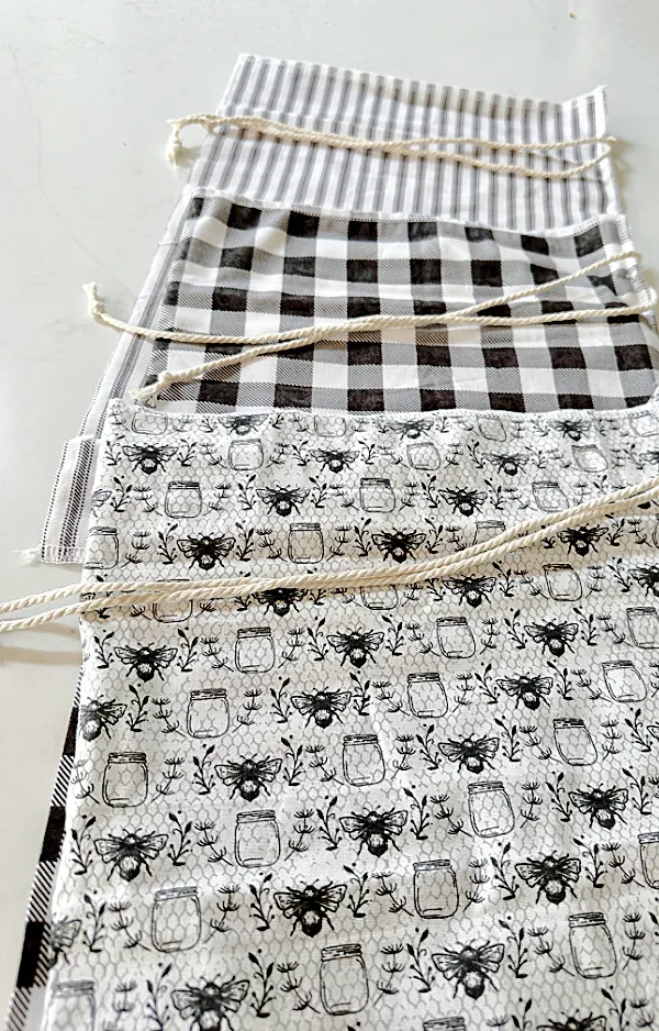 row of black and white fabric bags with ties