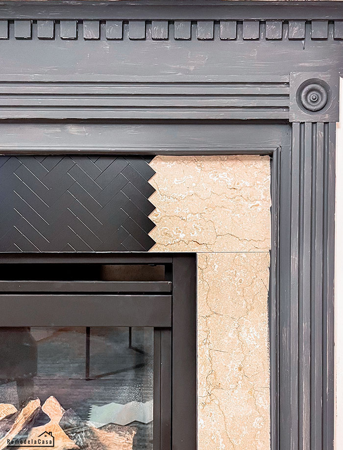 Charcoal gray fireplace with stick aluminum tile