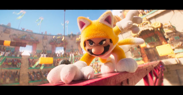 Imagem de Super Mario Bros.: O Filme que mostra Mario com uma fantasia de gato amarela em meio a uma arena com macacos na arquibancada.