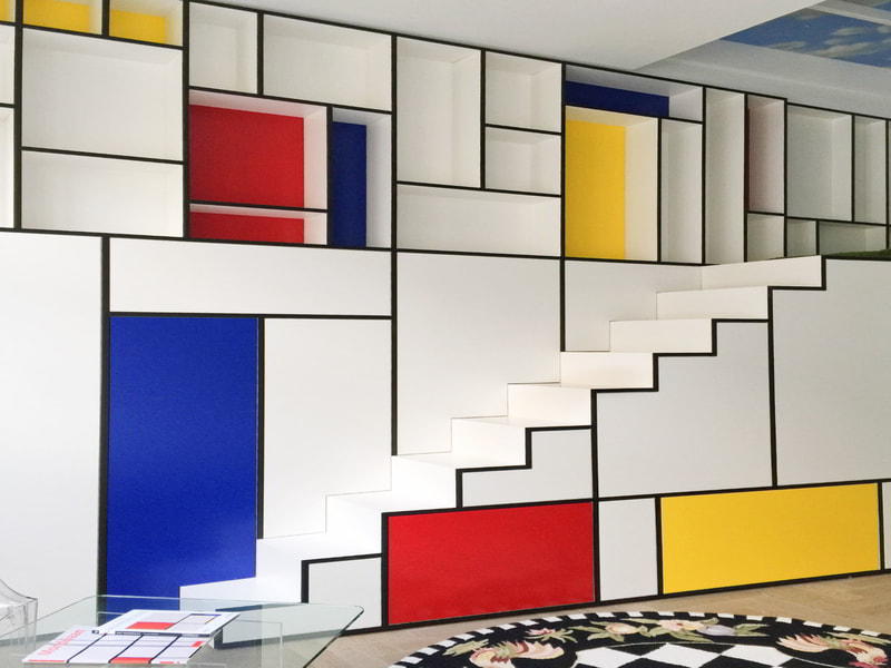 Đối với phiên bản nhiều màu, hãy lấy cảm hứng từ thiết kế nội thất lấy cảm hứng từ Mondrian . Khối hình khối có đường viền màu đen với màu vàng, xanh dương và đỏ chính cho tác phẩm De Stijl của riêng bạn.