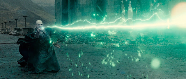 Voldemort is casting a green lightning with his wand.