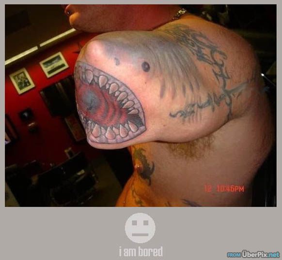 shark tattoo on amputated arm. I wonder how he lost his arm?