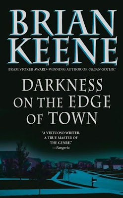 There is a town, and on the edge, itg is dark