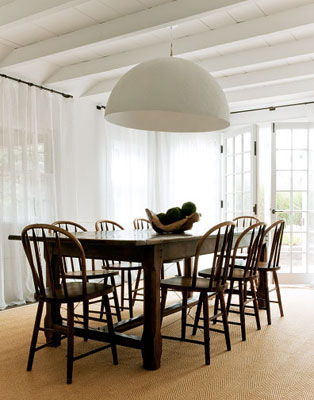 marie christine's cottage dining room with bentwood chairs, oversize dome pendant light, french doors, and white floor length curtains