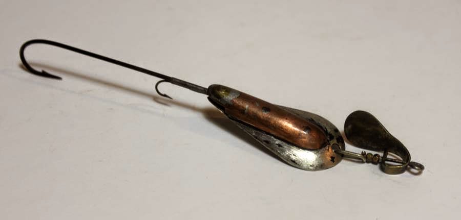 This old wood fishing lure is a Pflueger Globe and it comes with the  original box.This large lure was probably used for Musky fishing as it  measures