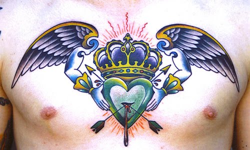 Heart crown and wings chest tattoo design.