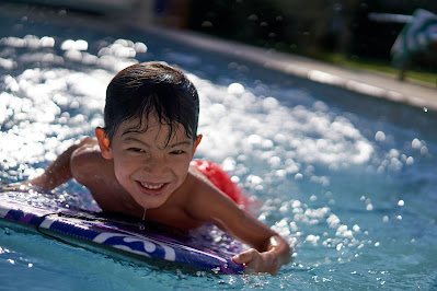 little boy swimming