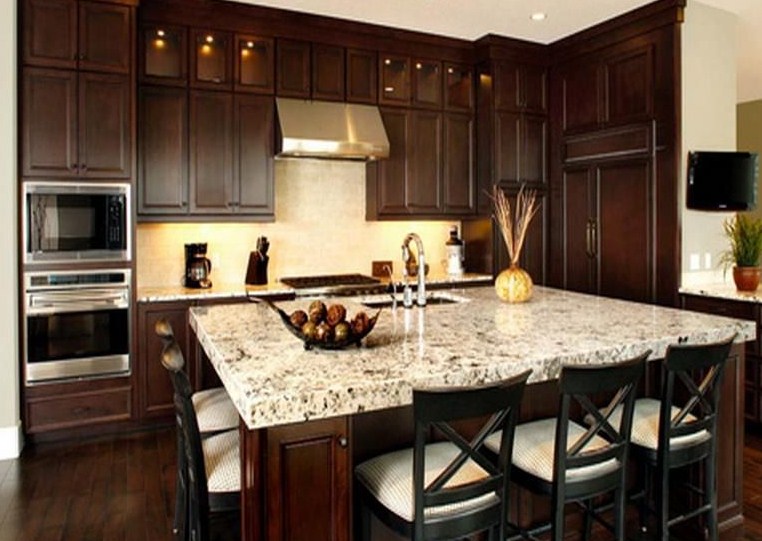 brown-kitchen-cabinets-with-black-countertops