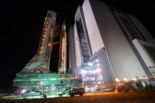 The mobile launcher carrying NASA's Space Launch System rocket exits from the Vehicle Assembly Building to begin its journey to Kennedy Space Center's Pad 39B for final flight preps...on August 16, 2022.