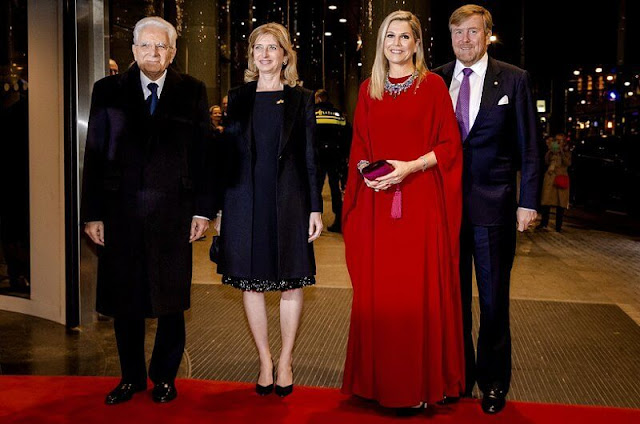 Queen Maxima wore a red silk cape kaftan dress by Valentino. multi stone gold diamond necklace. Gianvito Rossi suede pumps