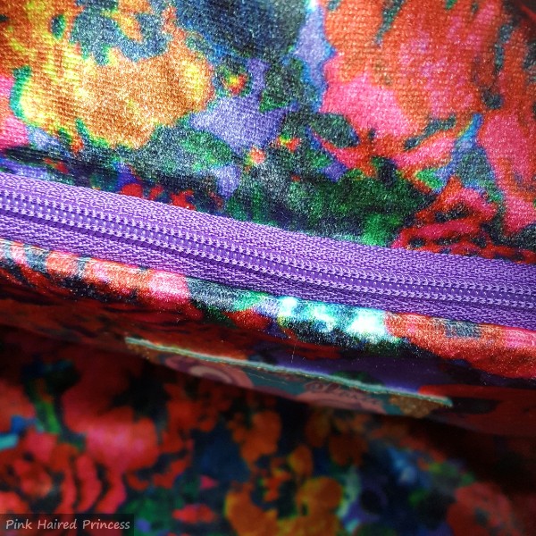 floral velvet lining and zipped pocket inside handbag