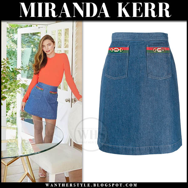 Miranda Kerr in orange sweater and denim mini skirt