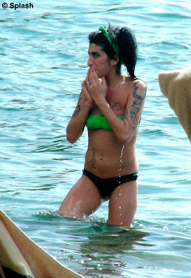 Amy Winehouse and her husband Blake Fielder-Civiland canoodled on a sunshine holiday on the Caribbean isle of St Lucia 