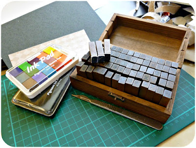 Set of stamps in a wooden box and pigment inks.