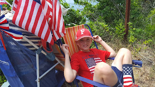 celebrating July 4th in patriotic gear with flags