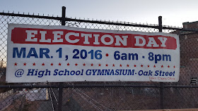 the election day sign on the railroad bridge