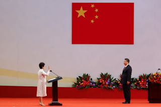 China's Xi Warns Hong Kong To Toe The Line As He Swears In New Leader