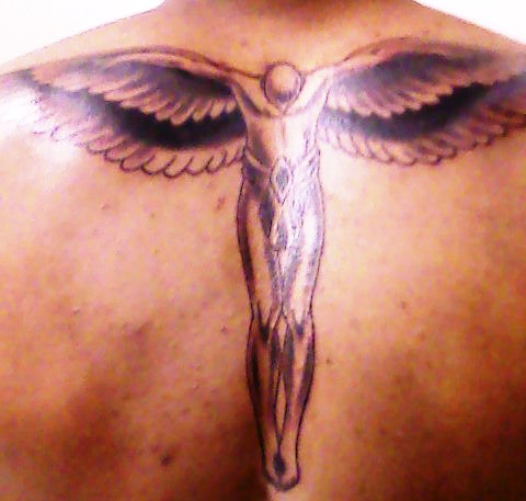 Open wings on center of guys back