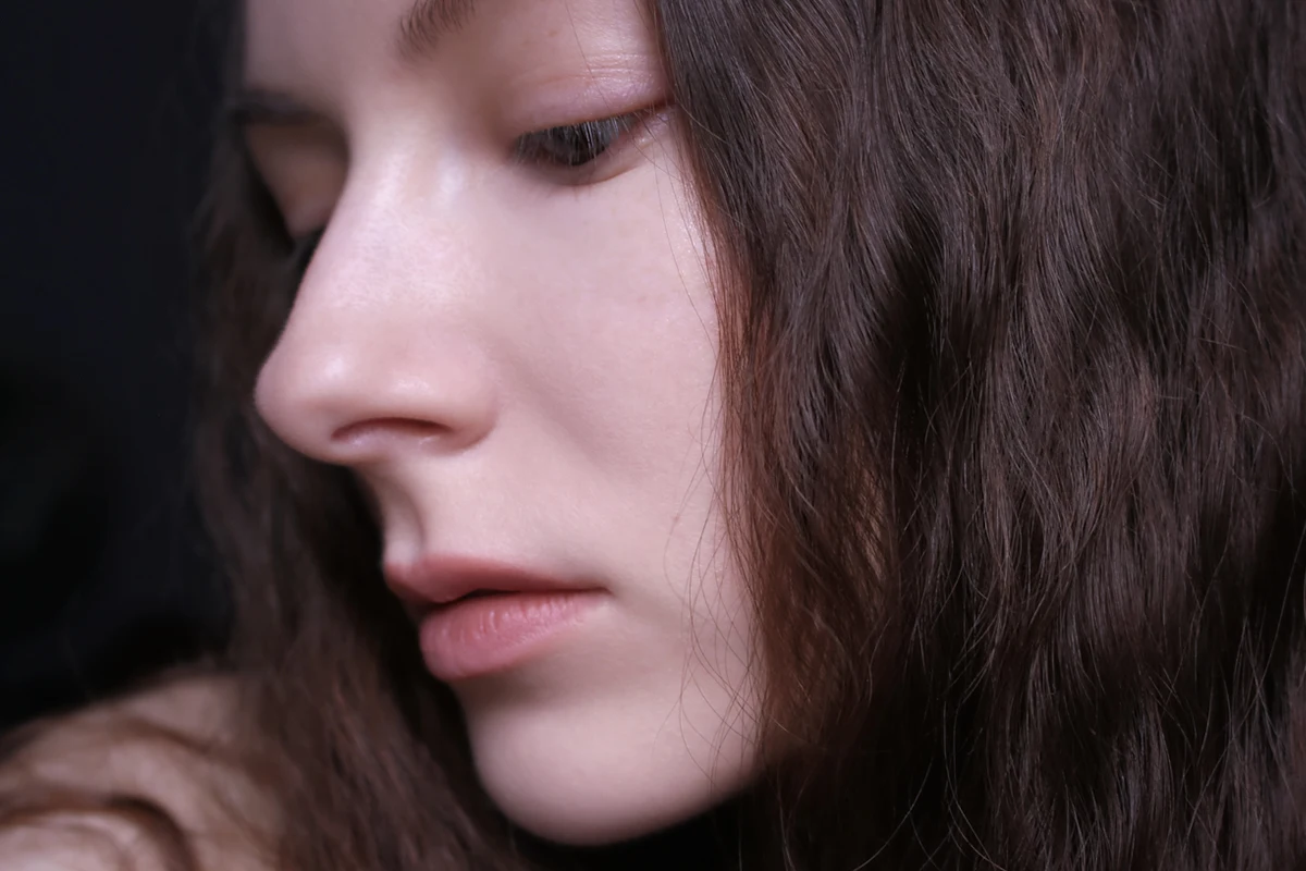 close-up shot of womans face with no makeup