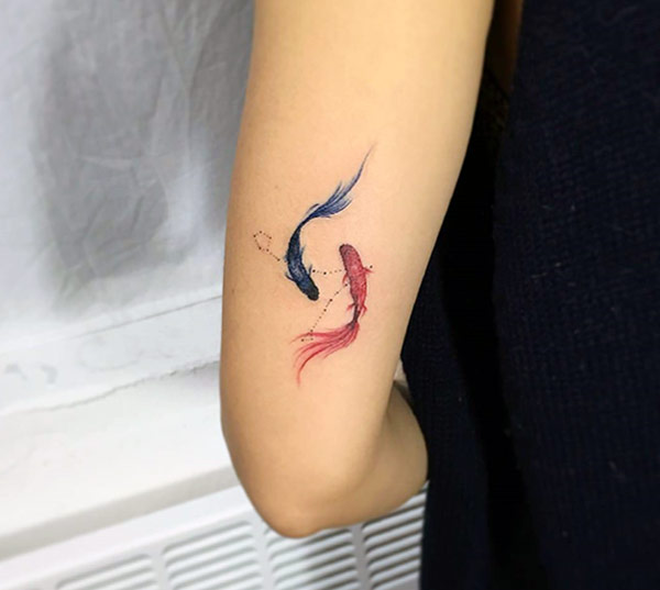 That is really so nice small koi fish colorful tattoo designs for the girls on back of arm.