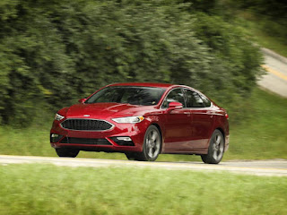 2018 Ford Fusion Sport front three quarter red on road