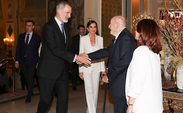 Carolina Herrera trousers. Queen Letizia wore a white blazer by Carolina Herrera, and a lace trim blouse by Zara