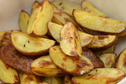 Oven-baked potato wedges with caraway seeds