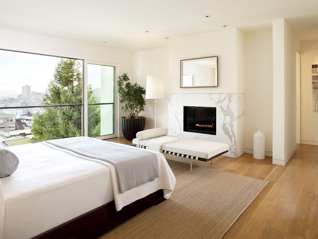 Bright white bedroom with a view