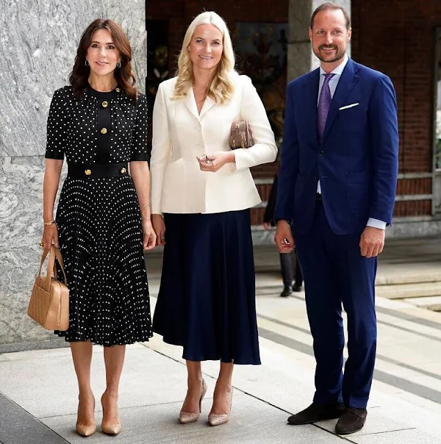 Crown Princess Mary wore a polka-dot pleated dress by Prada. Crown Princess Mette-Marit and Crown Prince Haakon