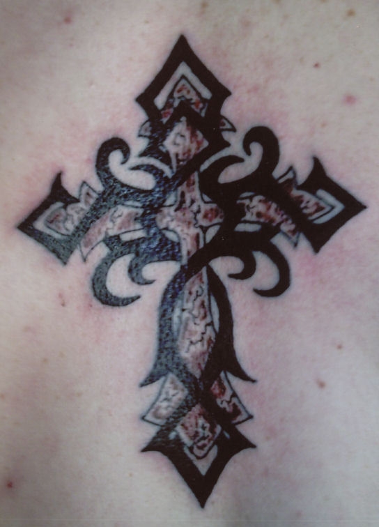  tribal wings and cross tattoo 