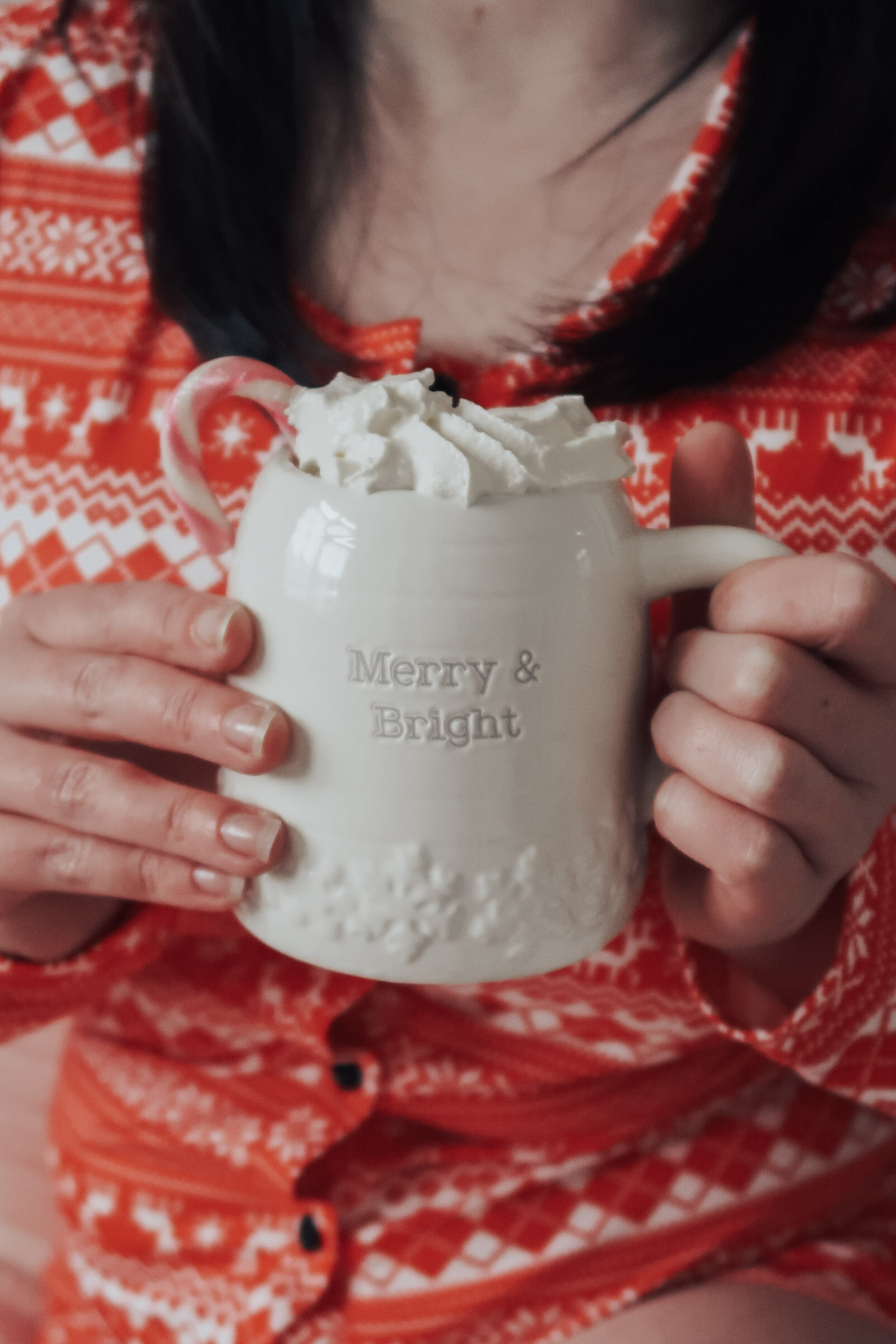 A Christmas mug with 'Merry & Bright' on it.