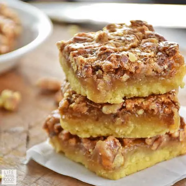 A stack of three Pecan Pie Bars ready to eat.