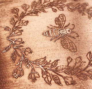 etched copper with bee design