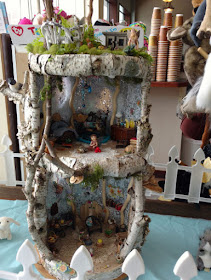 fairy house made of birch bark and moss