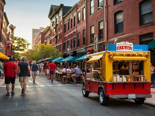 A vibrant collage showcasing Boston's diverse culinary scene. Iconic dishes like clam chowder and lobster rolls, scenes from Little Italy and Chinatown, and the dynamic world of food trucks and craft brews. An enticing visual feast capturing the city's gastronomic symphony.