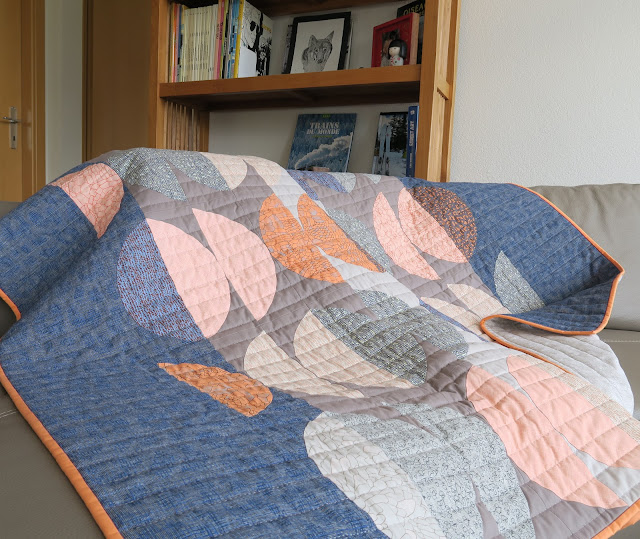 Luna Lovequilts - Half circle quilt on the sofa